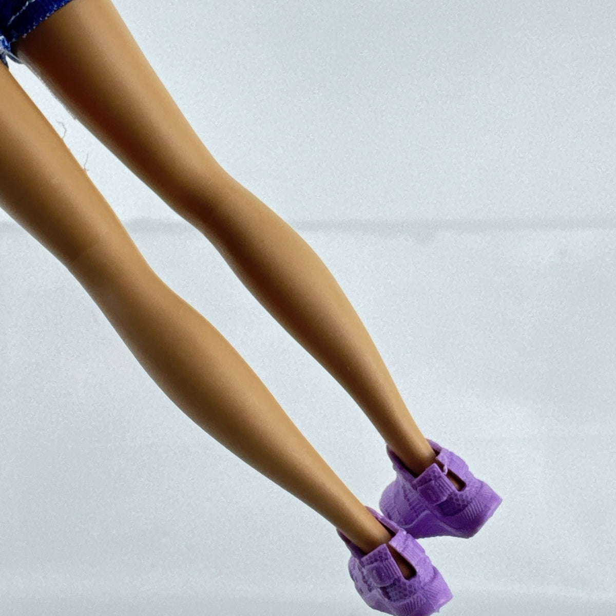 Mattel Barbie Skipper Babysitters Inc doll with purple streaked hair, blue gingham top, and shorts