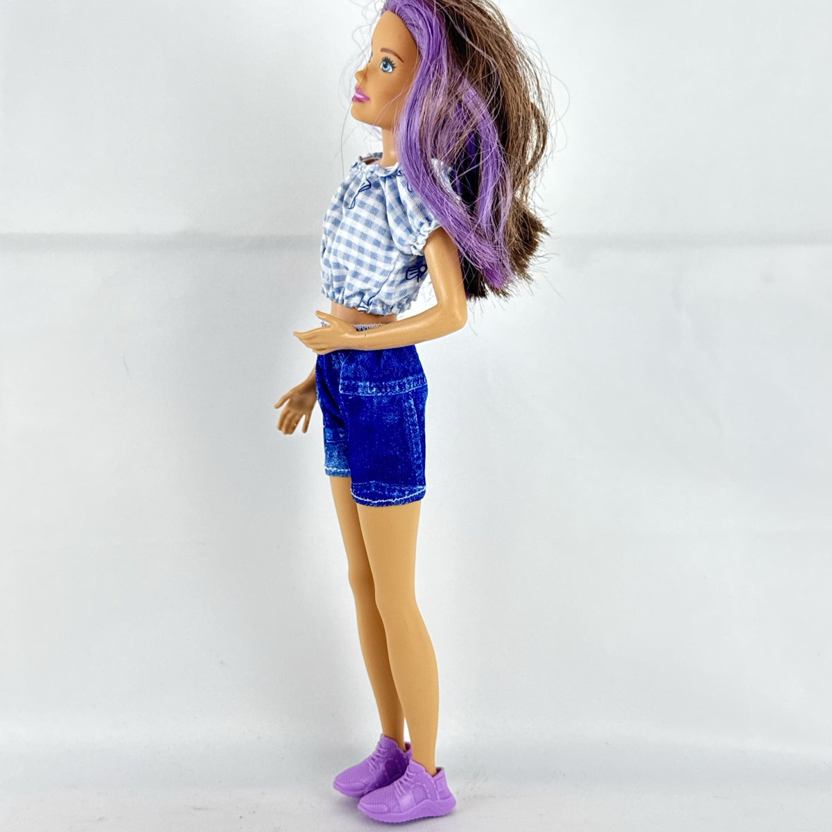 Mattel Barbie Skipper Babysitters Inc doll with purple streaked hair, blue gingham top, and shorts