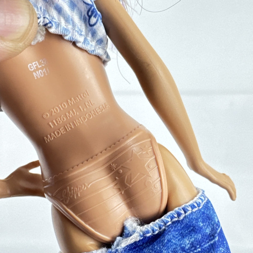 Mattel Barbie Skipper Babysitters Inc doll with purple streaked hair, blue gingham top, and shorts