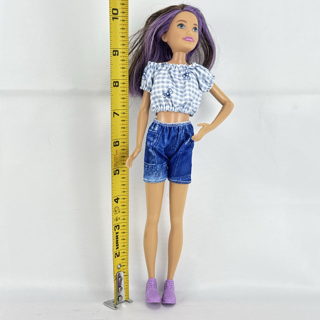 Mattel Barbie Skipper Babysitters Inc doll with purple streaked hair, blue gingham top, and shorts