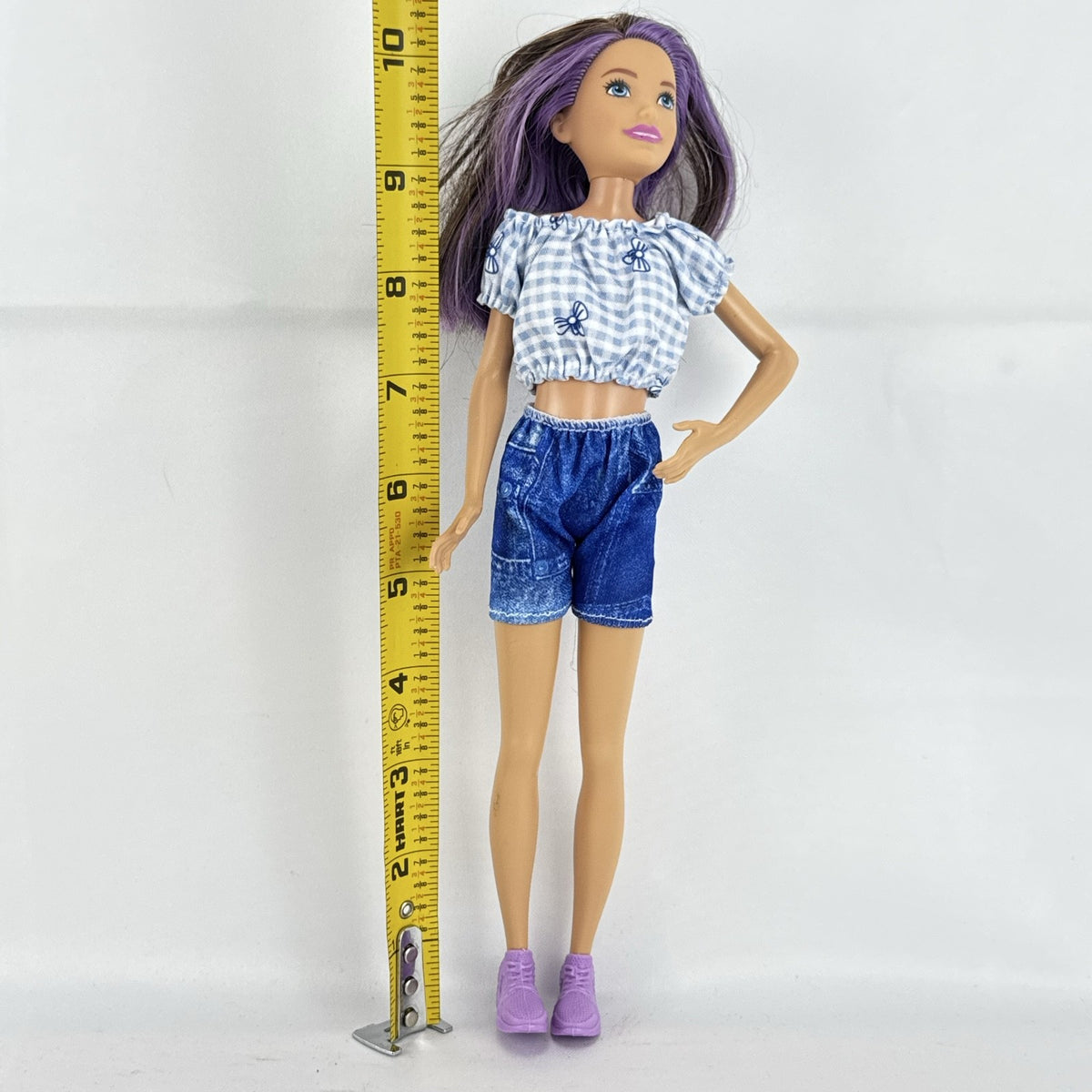 Mattel Barbie Skipper Babysitters Inc doll with purple streaked hair, blue gingham top, and shorts