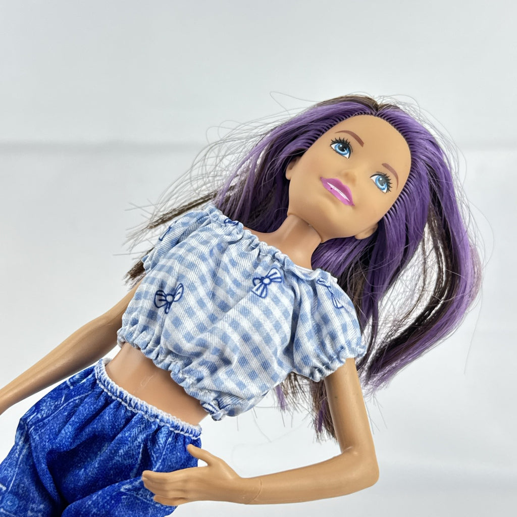 Mattel Barbie Skipper Babysitters Inc doll with purple streaked hair, blue gingham top, and shorts