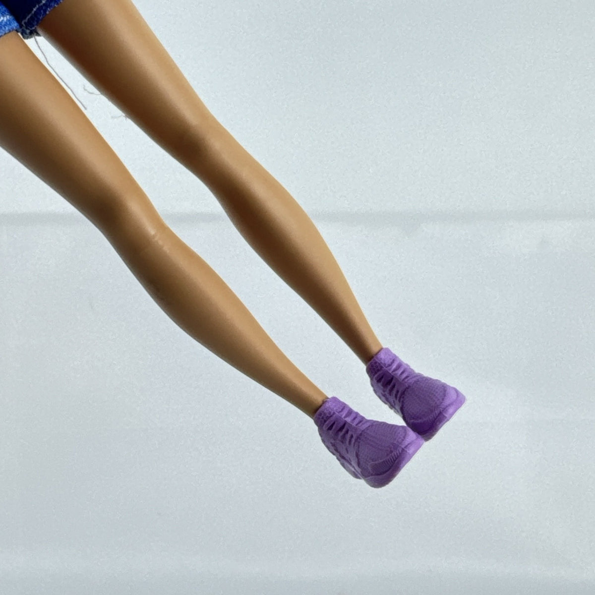 Mattel Barbie Skipper Babysitters Inc doll with purple streaked hair, blue gingham top, and shorts