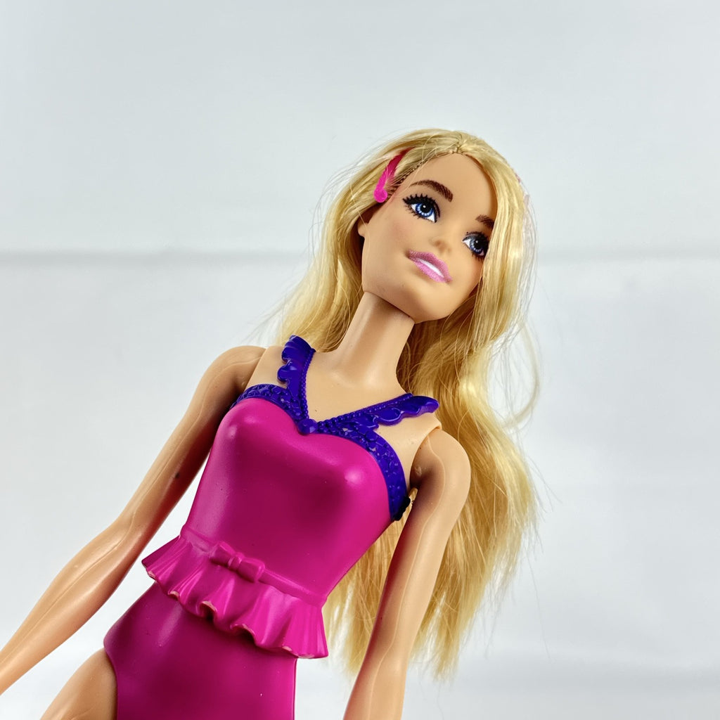 Mattel Barbie Dreamtopia ballerina doll with blonde hair, pink molded leotard, and tiara