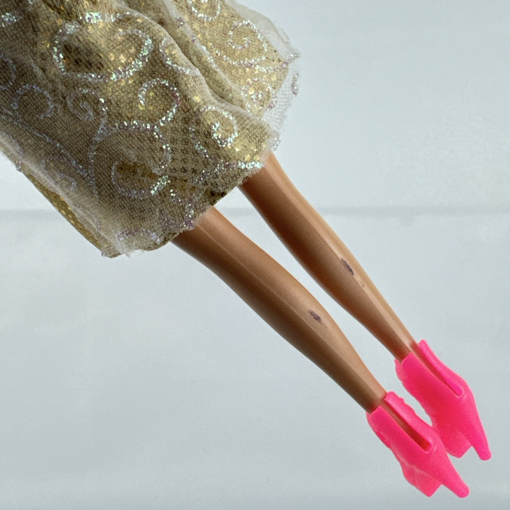 ZURU Sparkle Girlz 10-inch fashion doll with brown hair, cream and gold dress, and bright pink boots