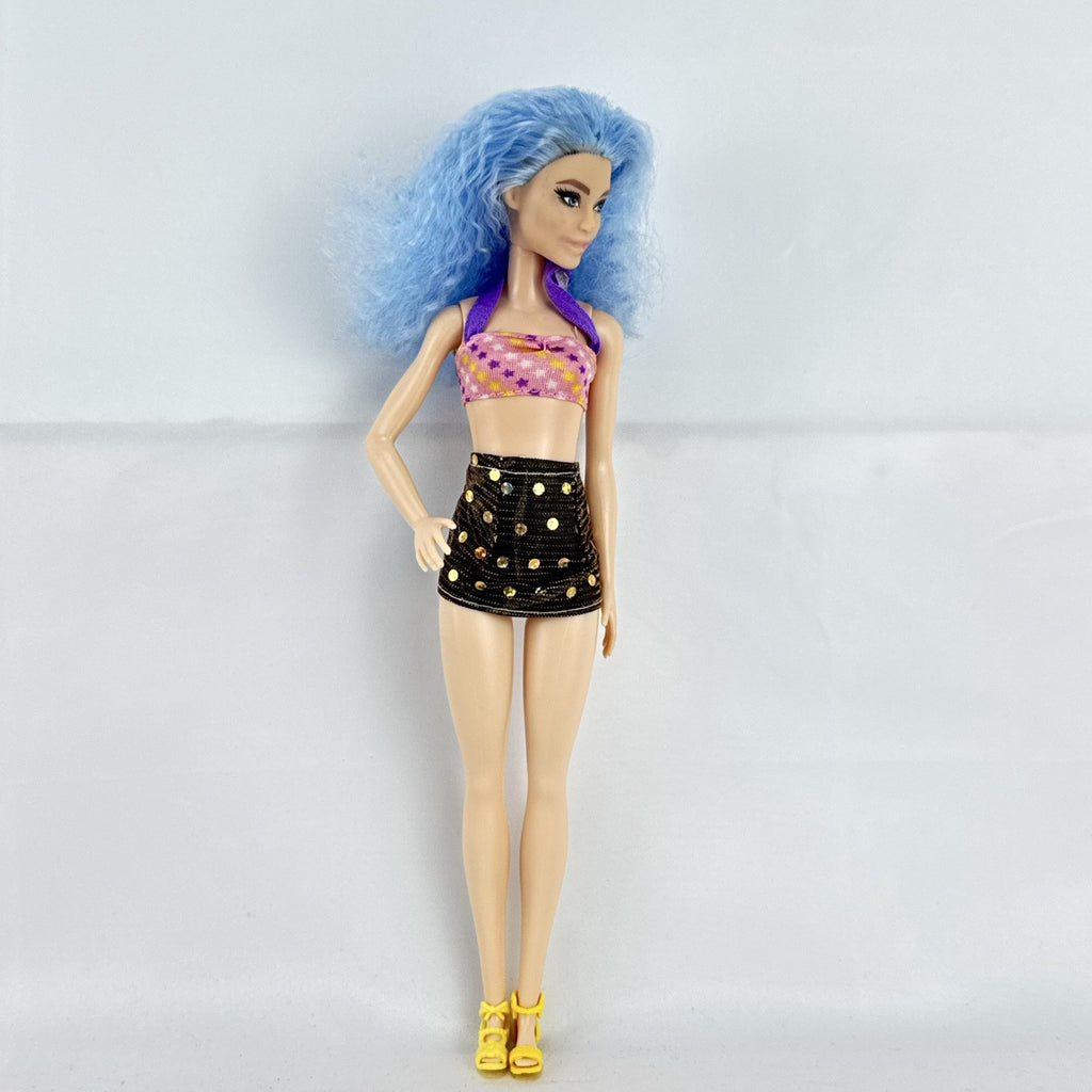 Mattel Barbie Fashionistas 12-inch doll with curly light blue hair, halter crop top, and gold sequin skirt