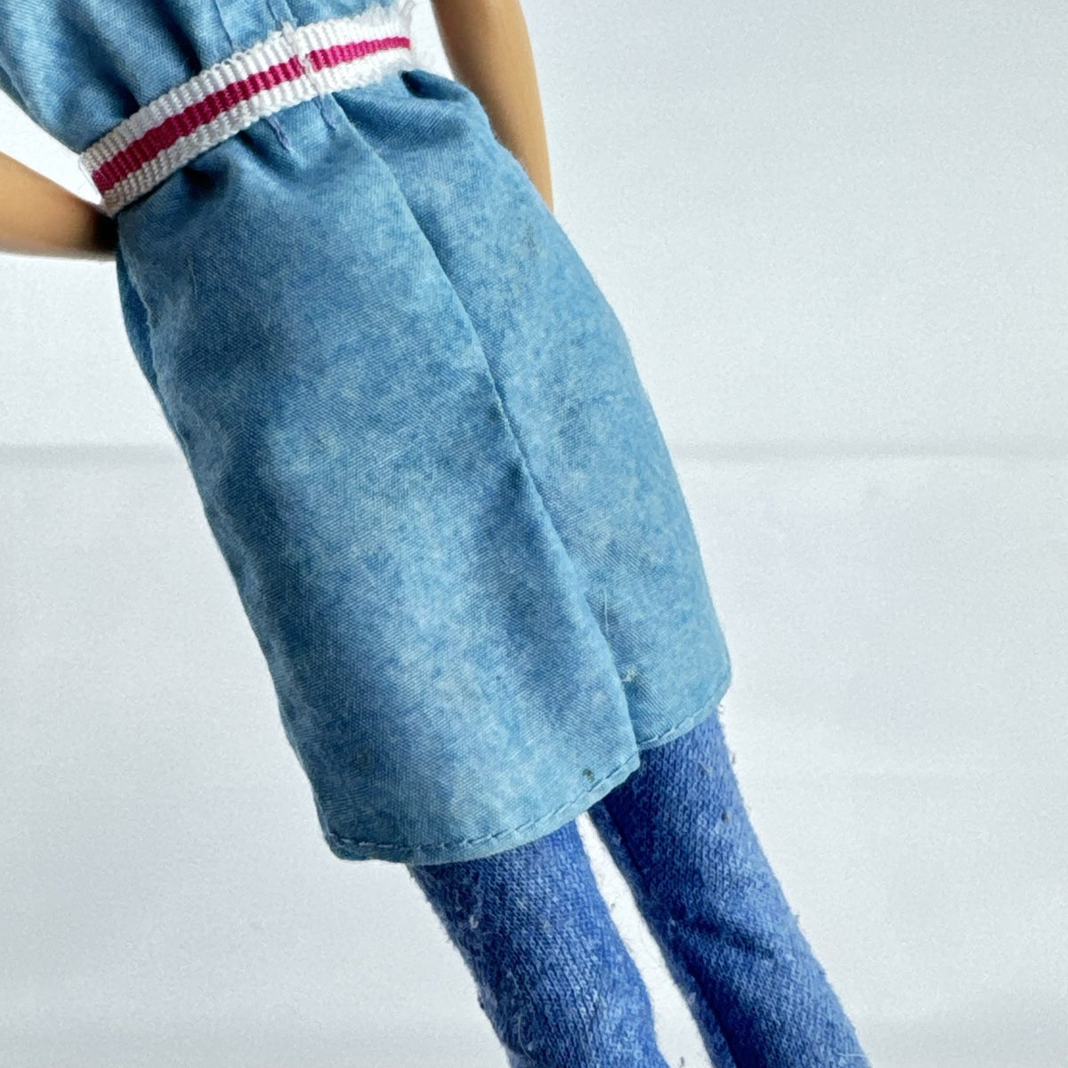 Mattel Barbie Dreamhouse Adventures Skipper doll with purple hair in denim tunic and white shoes