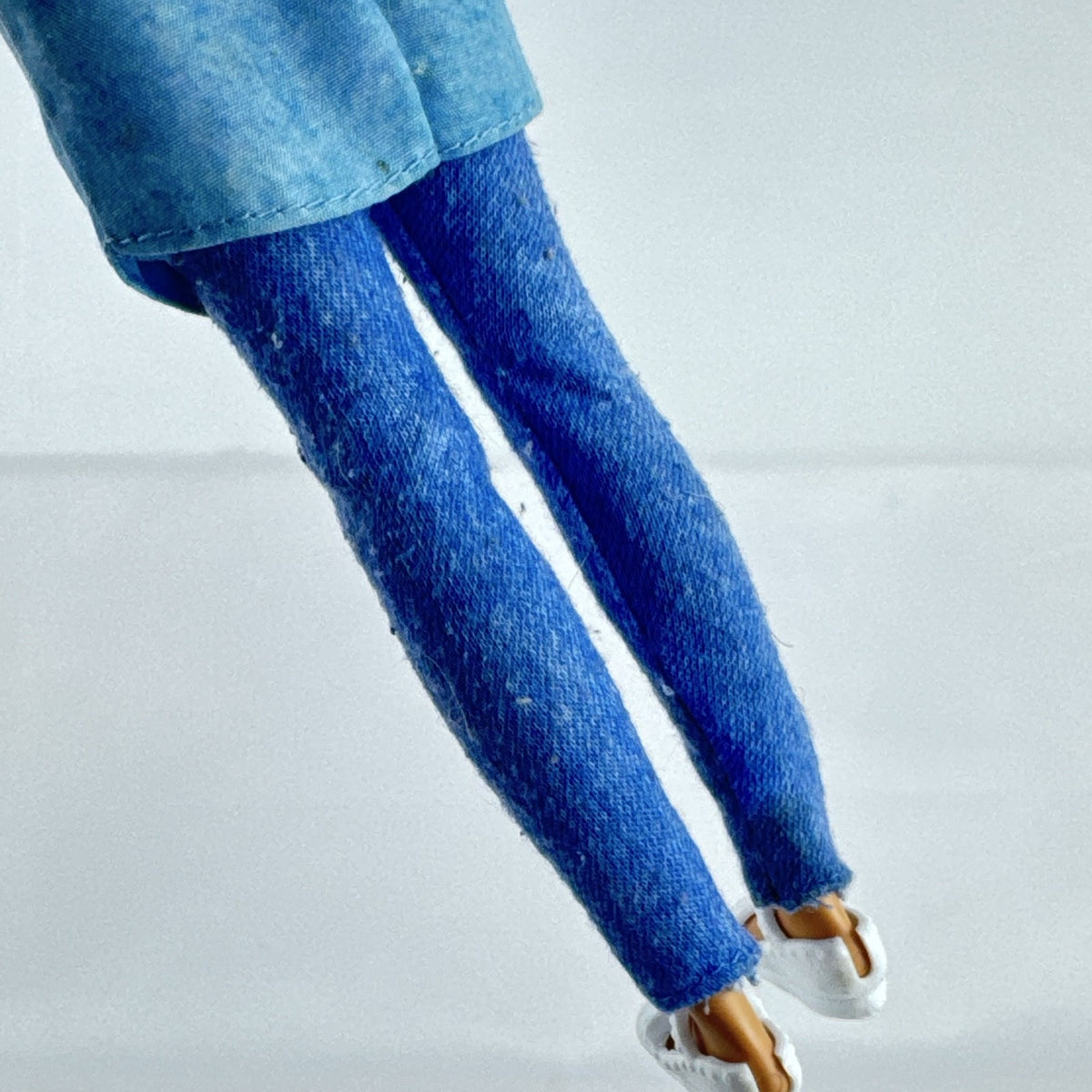 Mattel Barbie Dreamhouse Adventures Skipper doll with purple hair in denim tunic and white shoes