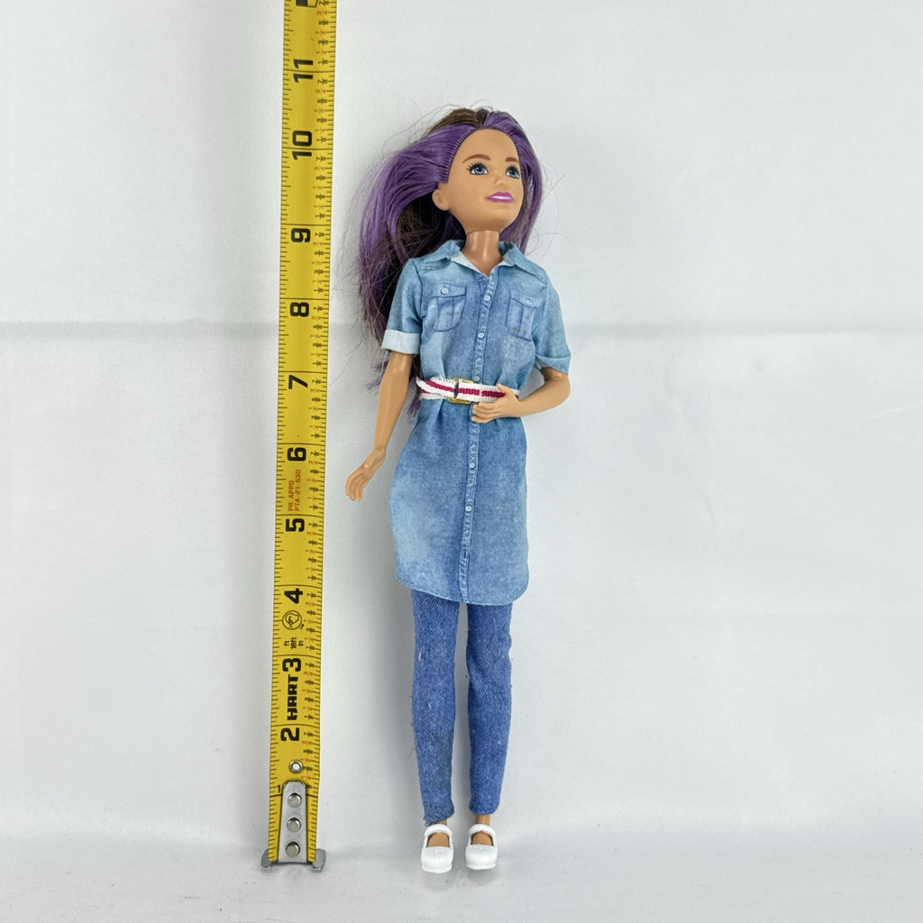 Mattel Barbie Dreamhouse Adventures Skipper doll with purple hair in denim tunic and white shoes
