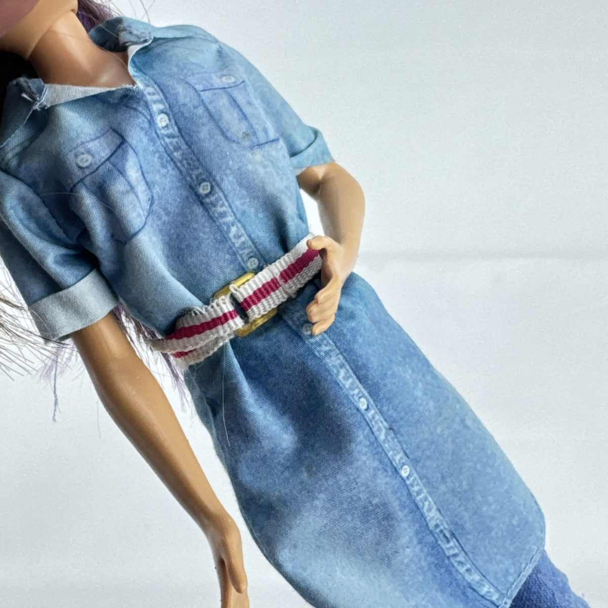 Mattel Barbie Dreamhouse Adventures Skipper doll with purple hair in denim tunic and white shoes