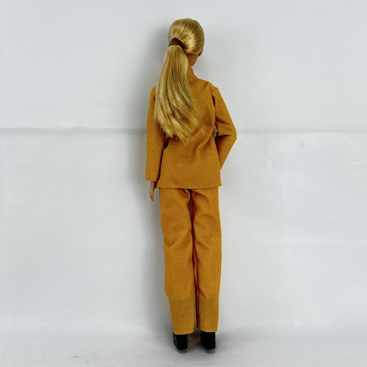 Mattel Barbie Careers blonde firefighter doll wearing yellow rescue suit and black boots