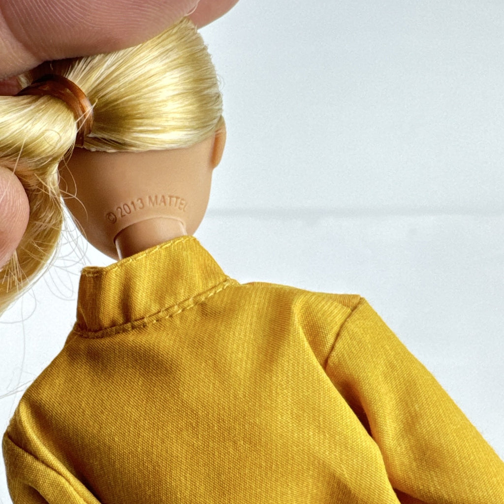 Mattel Barbie Careers blonde firefighter doll wearing yellow rescue suit and black boots