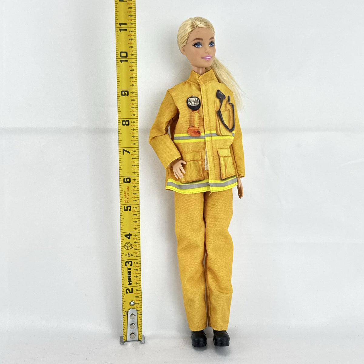 Mattel Barbie Careers blonde firefighter doll wearing yellow rescue suit and black boots