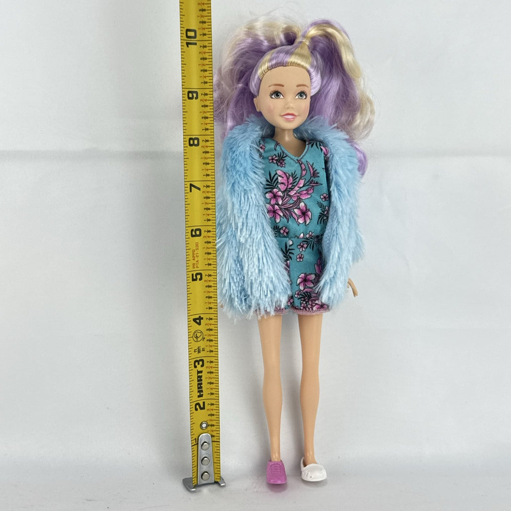 Just Play Hairdorables Hairmazing Harmony fashion doll with purple hair, floral romper, and light blue faux fur vest