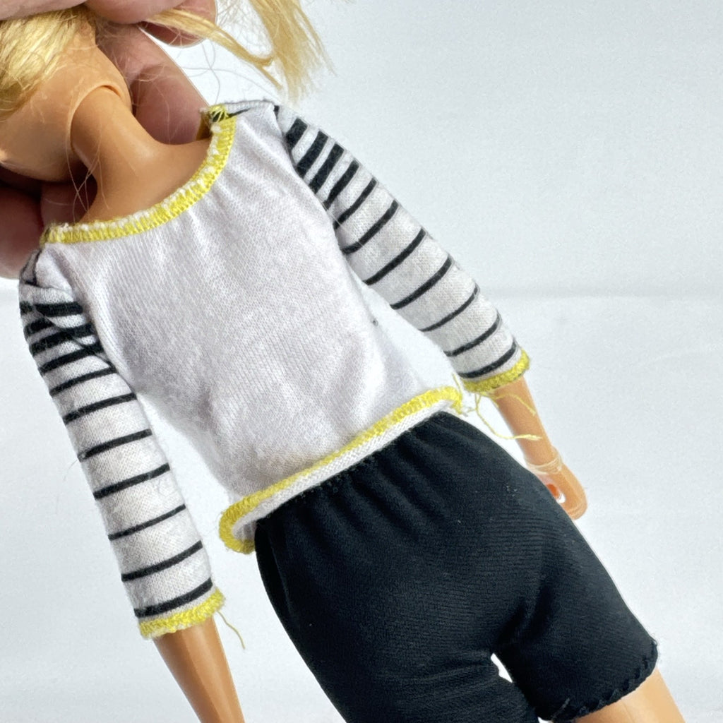 Mattel Barbie blonde ice skater doll with articulated knees wearing a striped athletic outfit and white skates