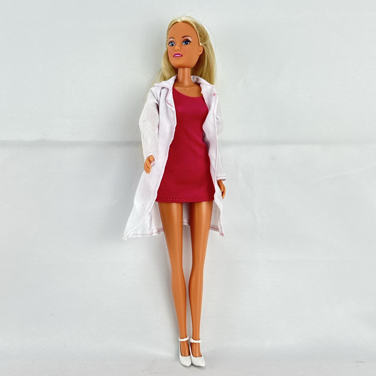 Simba Steffi Love blonde doctor doll wearing a white lab coat and pink knit dress