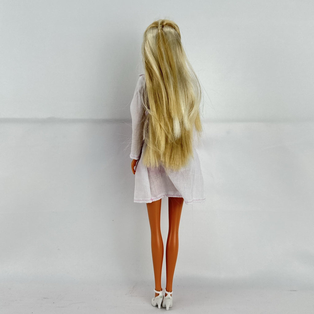 Simba Steffi Love blonde doctor doll wearing a white lab coat and pink knit dress