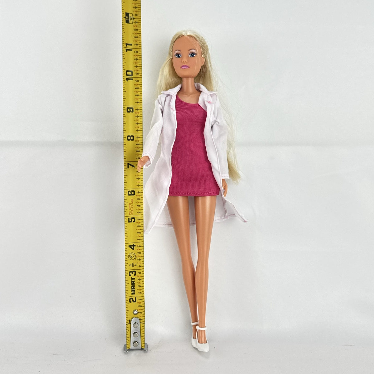 Simba Steffi Love blonde doctor doll wearing a white lab coat and pink knit dress
