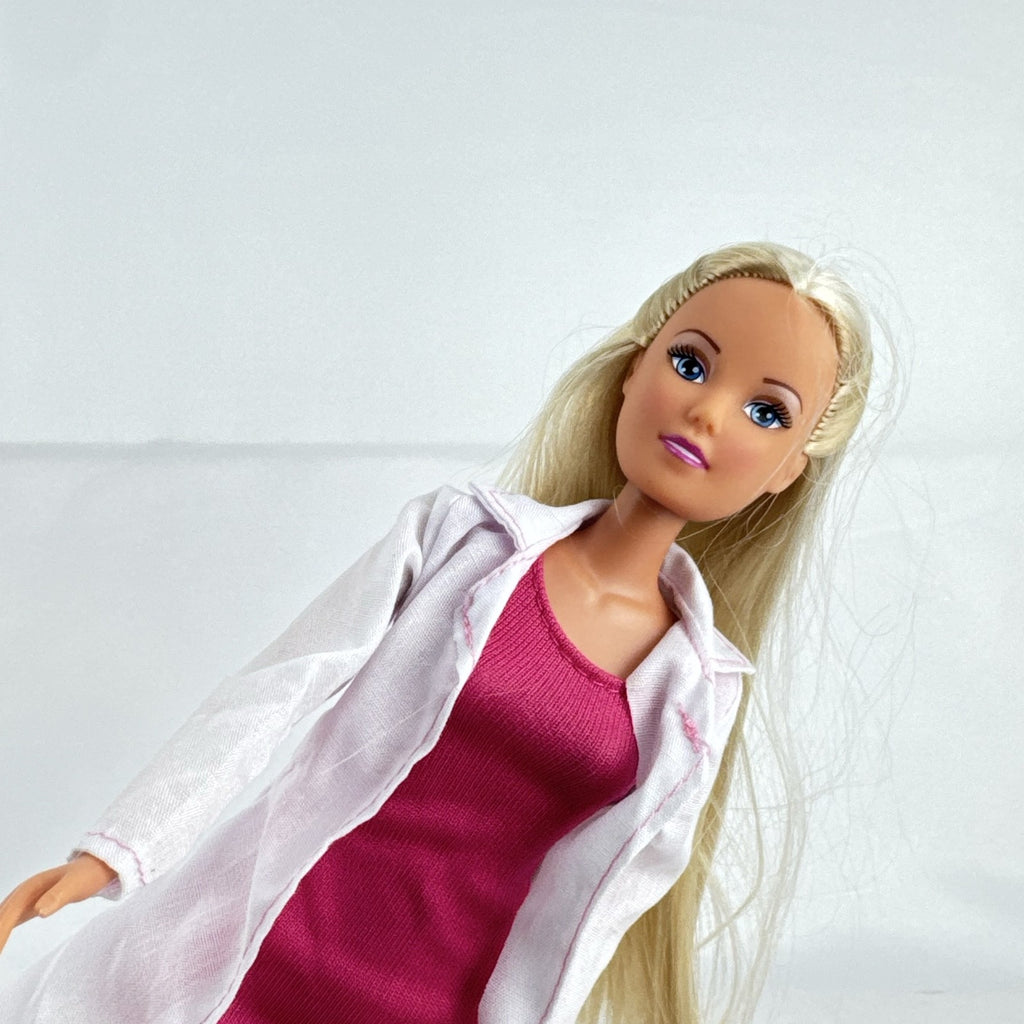 Simba Steffi Love blonde doctor doll wearing a white lab coat and pink knit dress