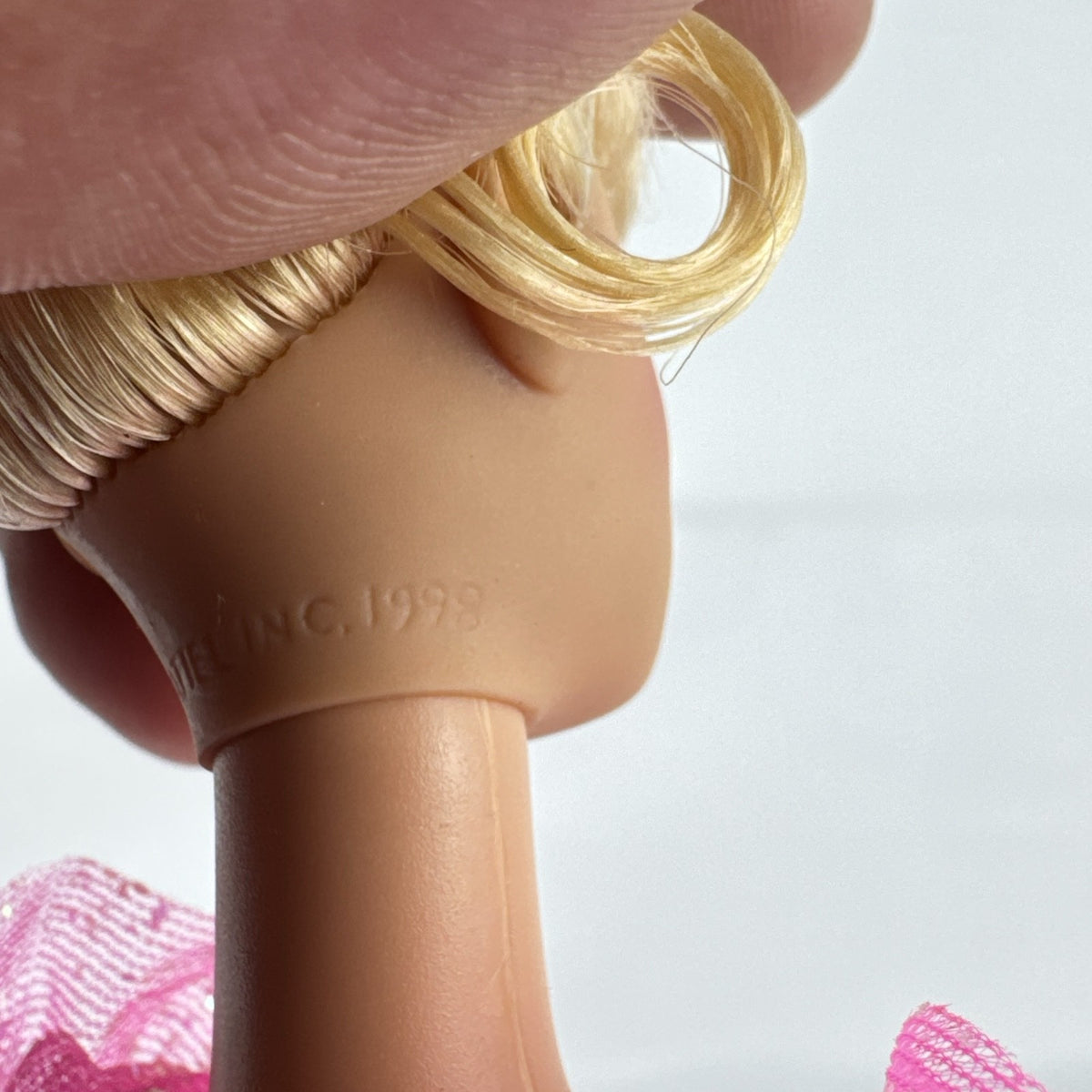 1998 Mattel blonde fairy Barbie doll in iridescent pink sparkle dress with pull-string twirling skirt