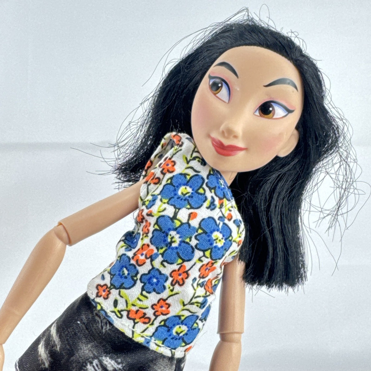 Disney Princess Comfy Squad Mulan 11-inch articulated fashion doll in casual floral top and boots
