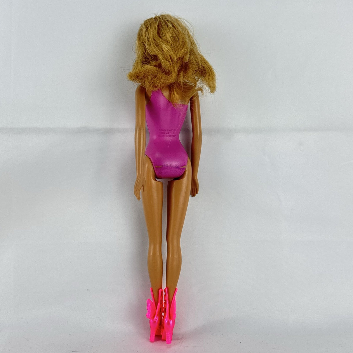 Mattel Barbie 11-inch doll wearing molded pink and polka dot swimsuit with pink strappy heels