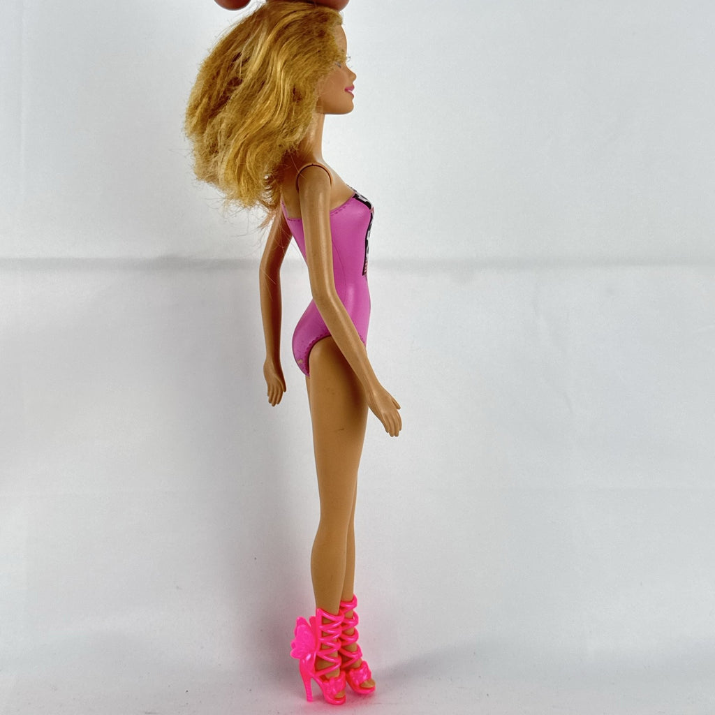 Mattel Barbie 11-inch doll wearing molded pink and polka dot swimsuit with pink strappy heels