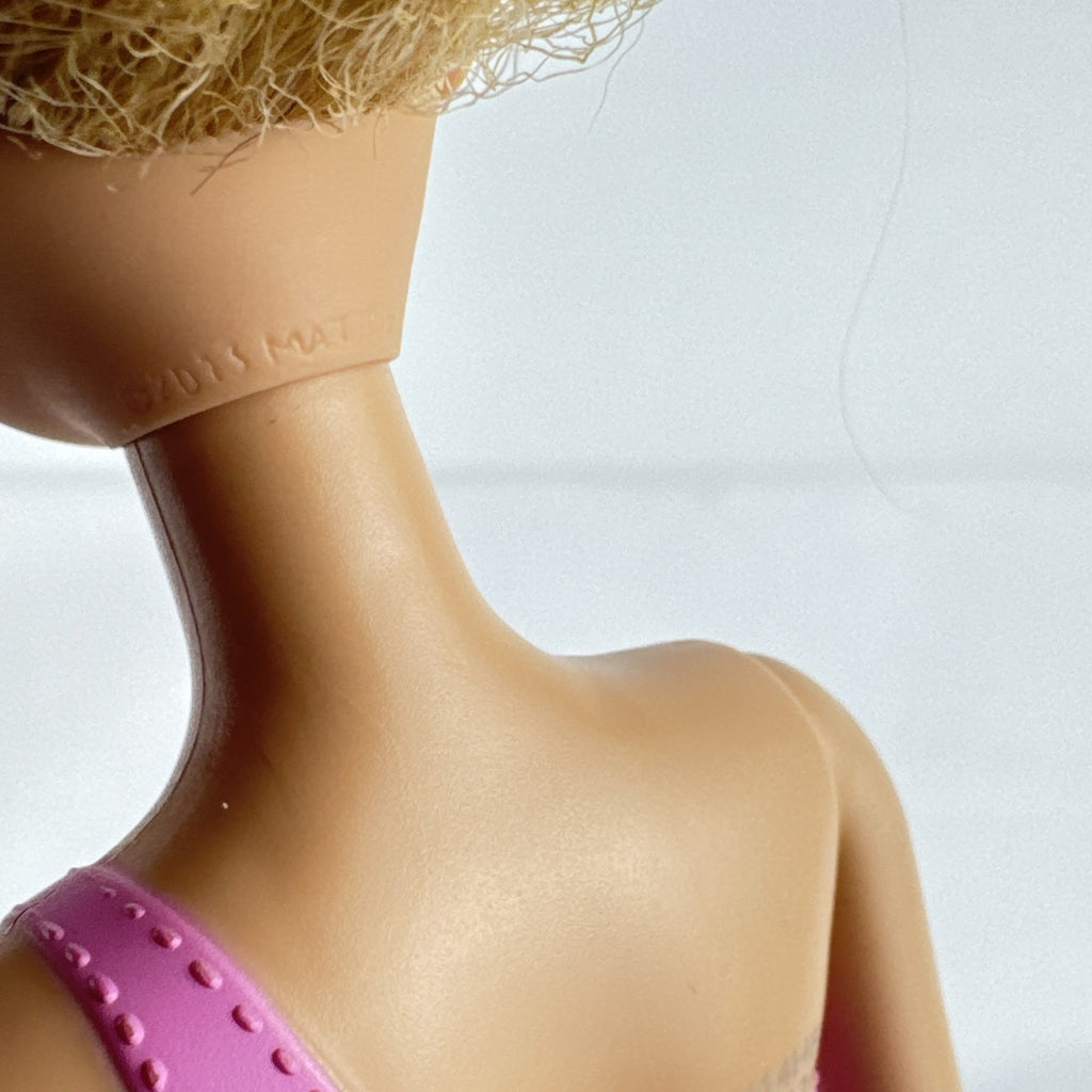 Mattel Barbie 11-inch doll wearing molded pink and polka dot swimsuit with pink strappy heels