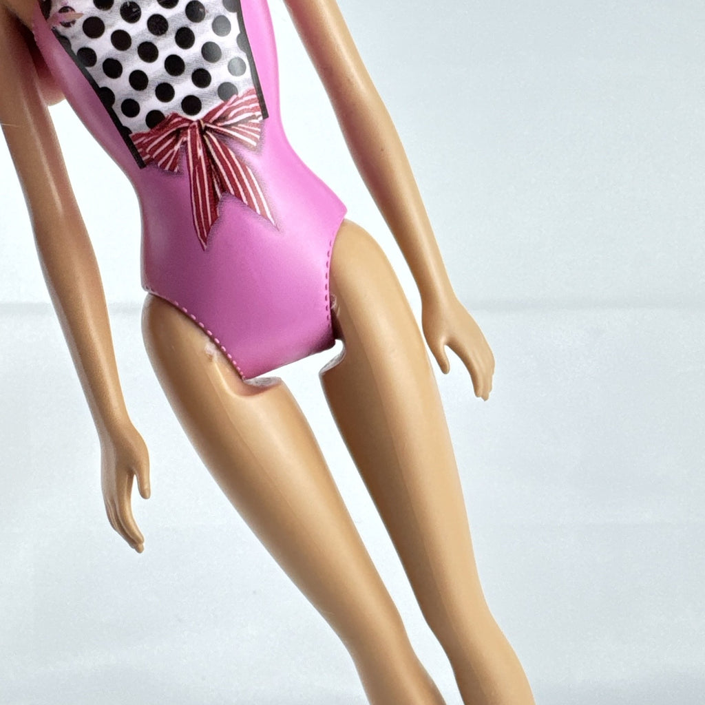 Mattel Barbie 11-inch doll wearing molded pink and polka dot swimsuit with pink strappy heels