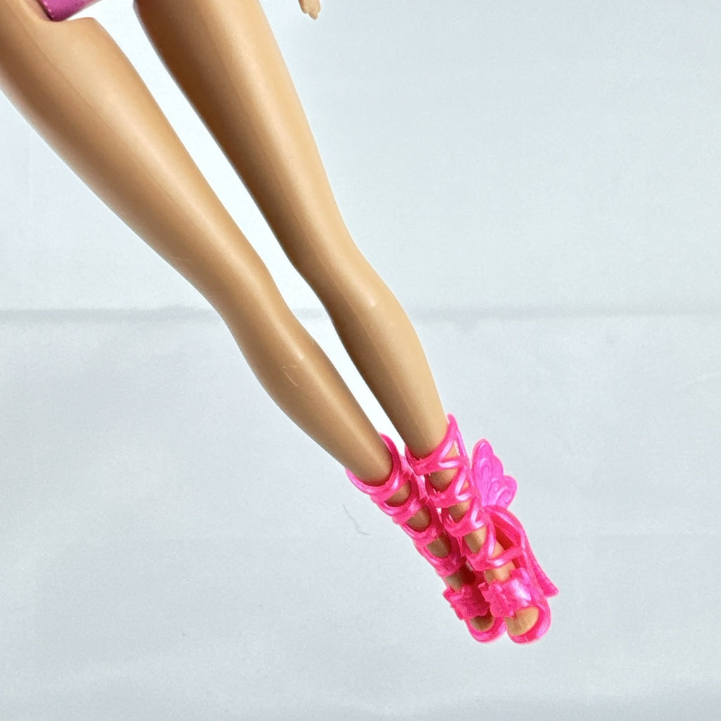 Mattel Barbie 11-inch doll wearing molded pink and polka dot swimsuit with pink strappy heels