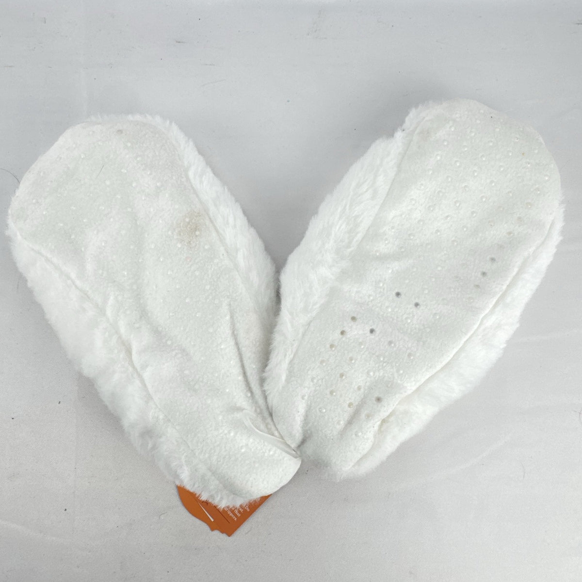 Hyde & EEK! Boutique ivory faux-fur slipper socks with black bat silhouettes and non-slip treads in women's size M/L.