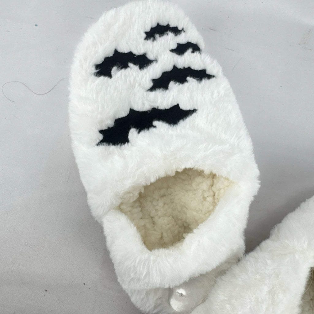 Hyde & EEK! Boutique ivory faux-fur slipper socks with black bat silhouettes and non-slip treads in women's size M/L.