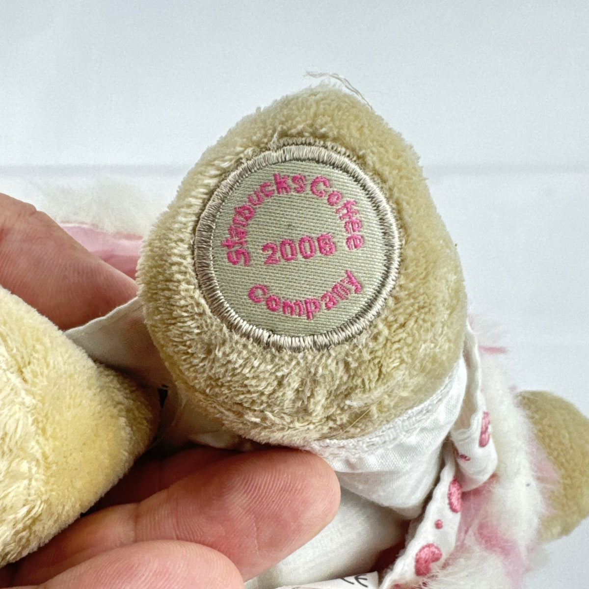 Starbucks 2006 Valentine Bearista plush bear wearing a pink faux fur coat and beret