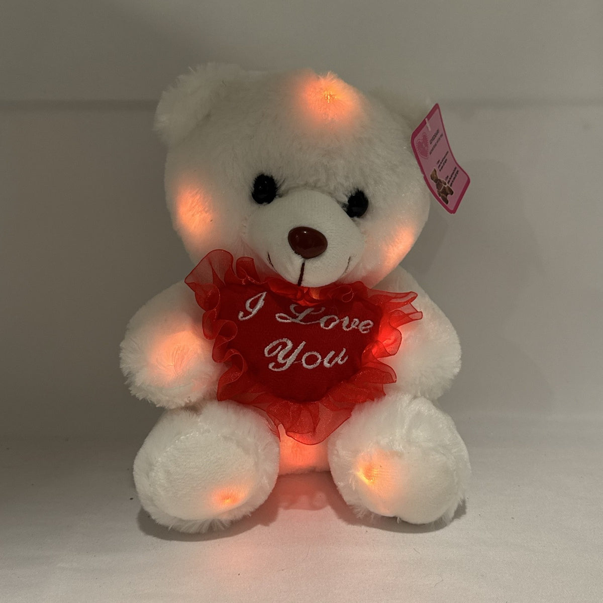 Givedears white plush teddy bear with illuminated LED lights holding an embroidered red I Love You heart