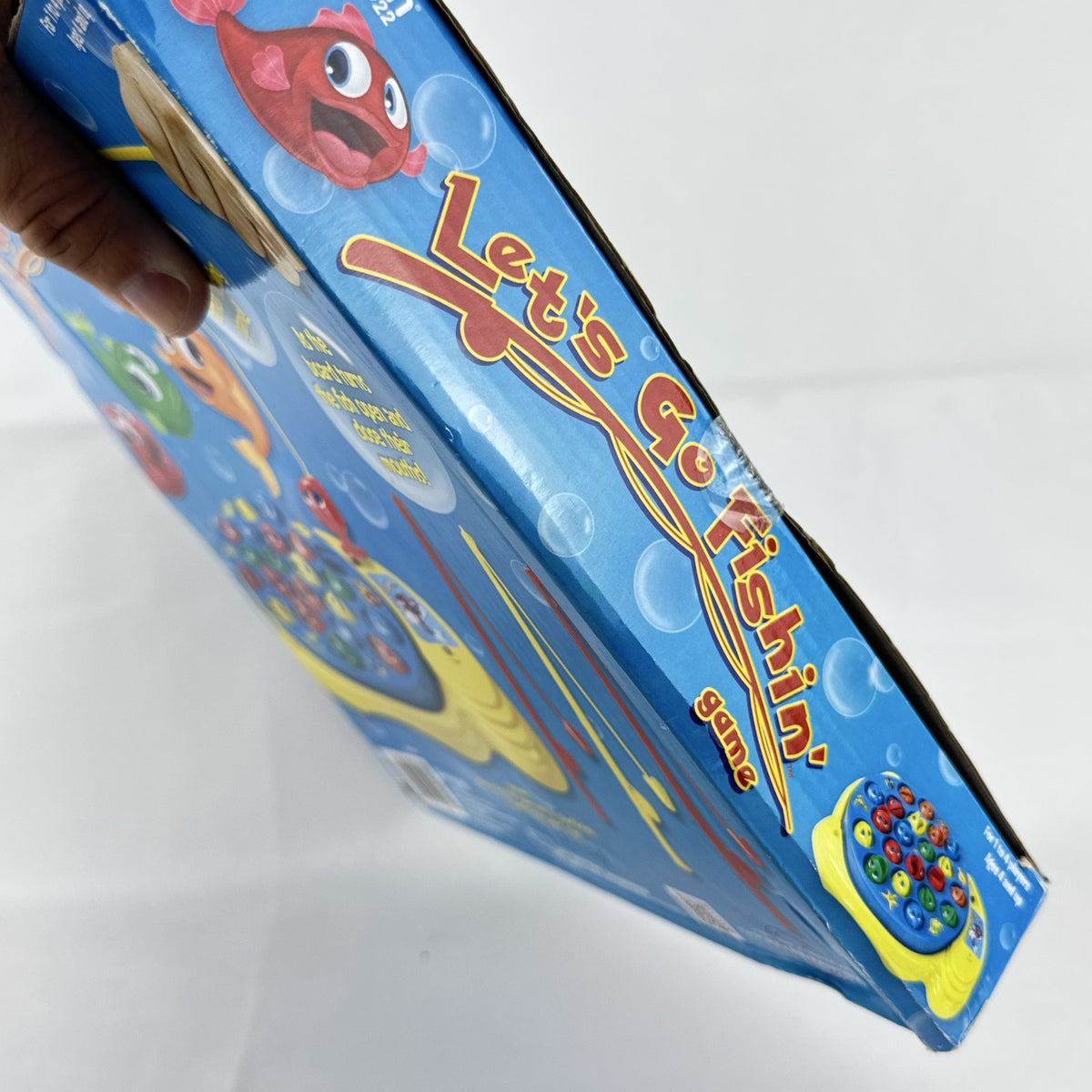 Pressman Let's Go Fishin' motorized action board game in original box with 21 fish and 4 poles