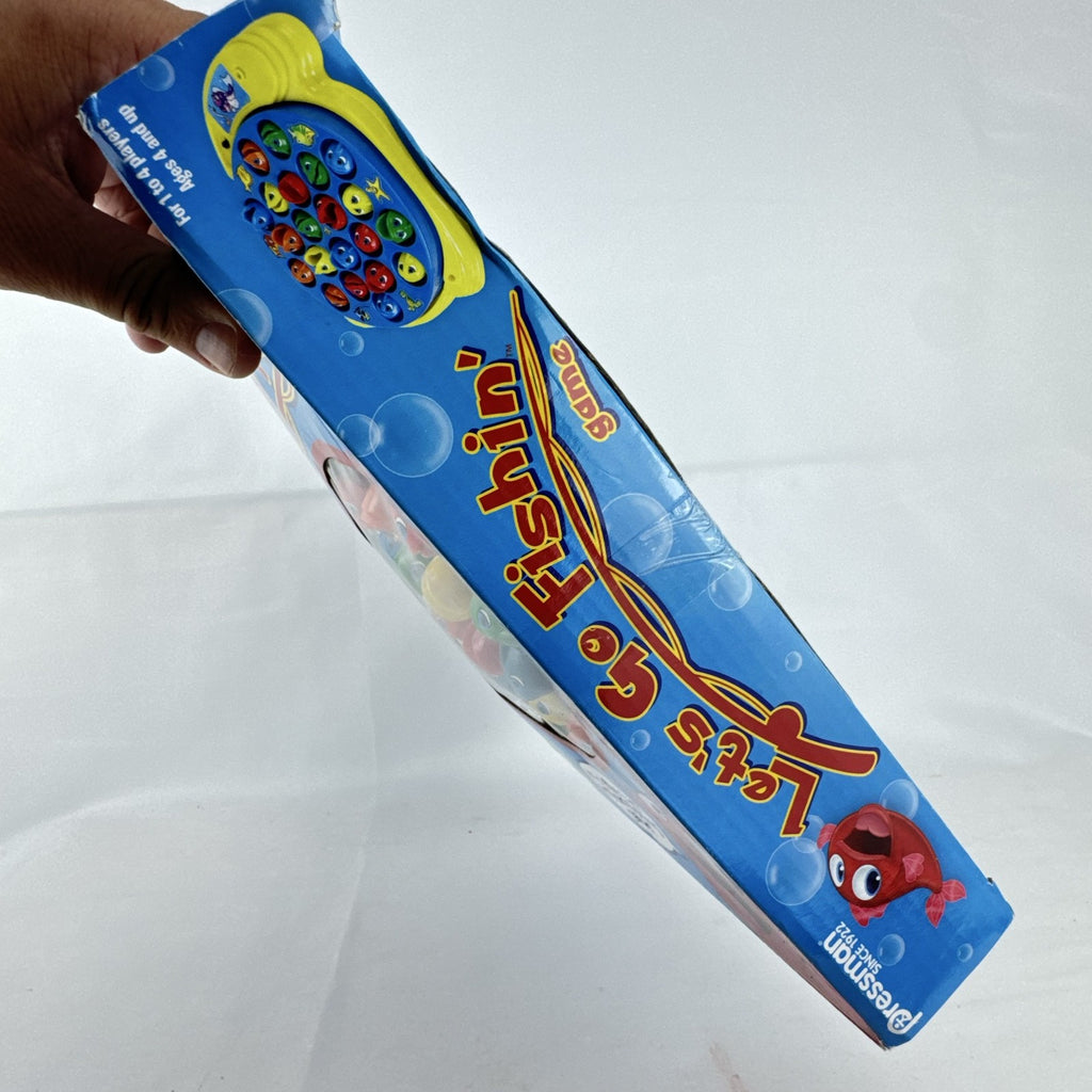 Pressman Let's Go Fishin' motorized action board game in original box with 21 fish and 4 poles