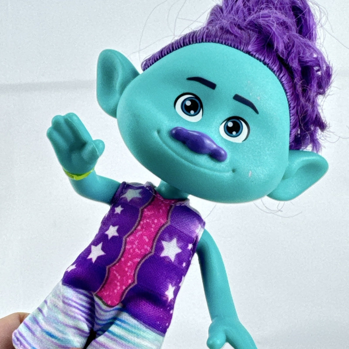 Mattel DreamWorks Trolls Band Together Bruce 8-inch doll in BroZone vest and shorts with purple hair bun