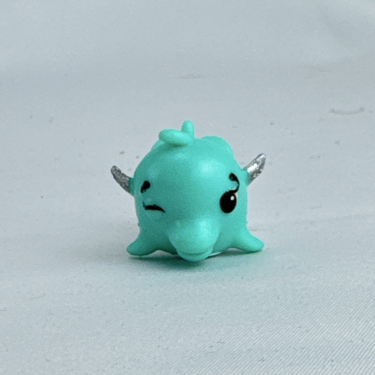 Spin Master Hatchimals CollEGGtibles Mermal Magic teal dolphin miniature figure with silver glitter wings