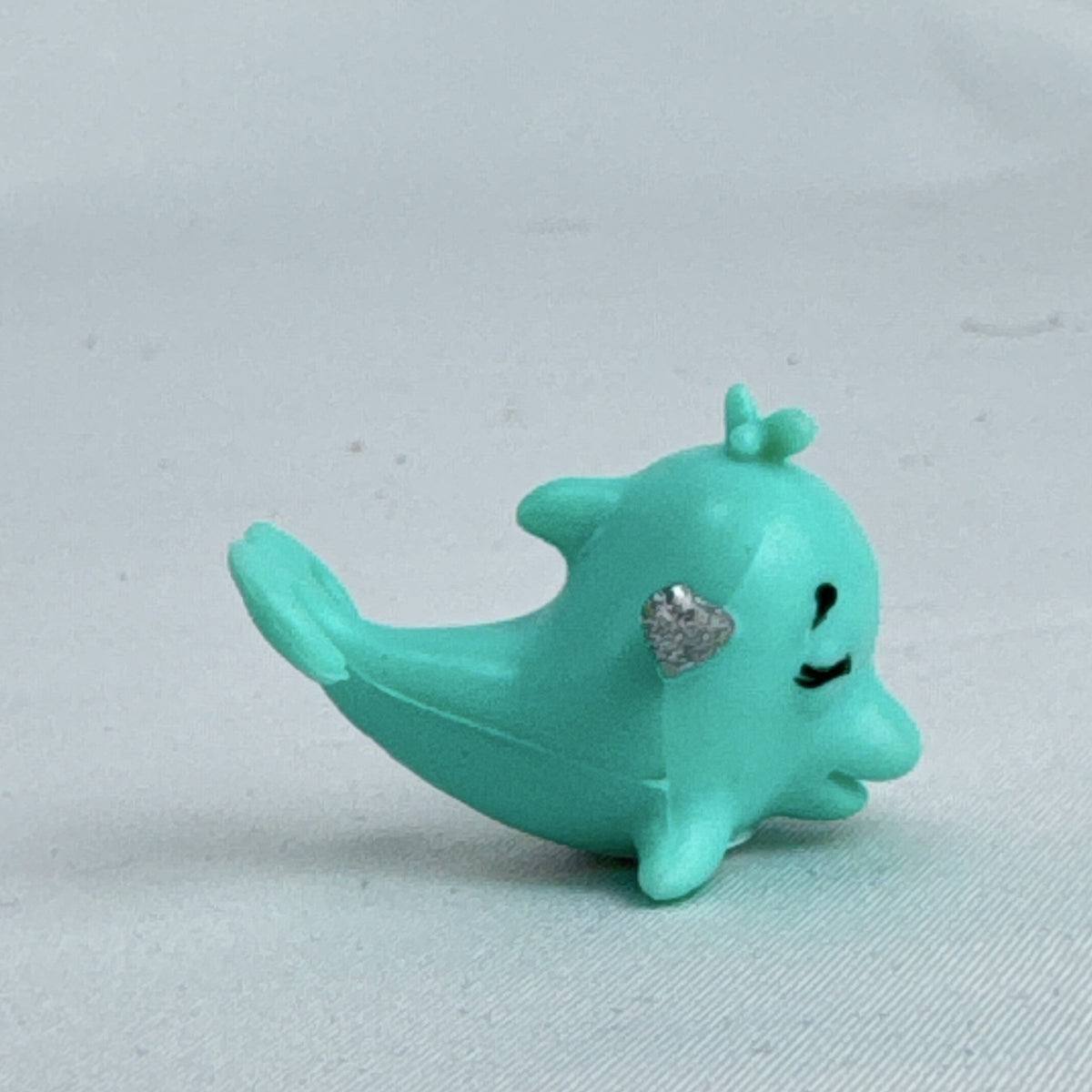 Spin Master Hatchimals CollEGGtibles Mermal Magic teal dolphin miniature figure with silver glitter wings