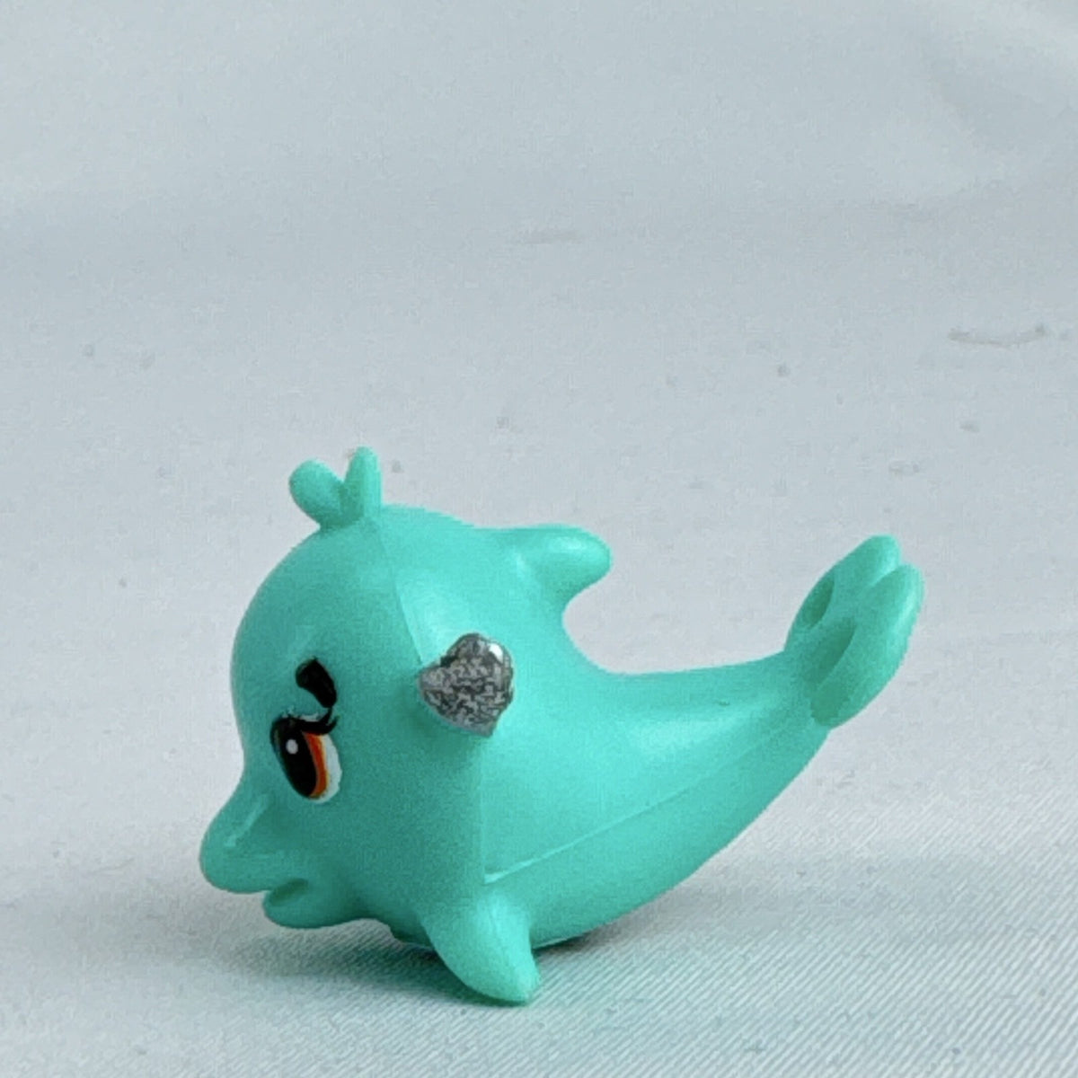 Spin Master Hatchimals CollEGGtibles Mermal Magic teal dolphin miniature figure with silver glitter wings