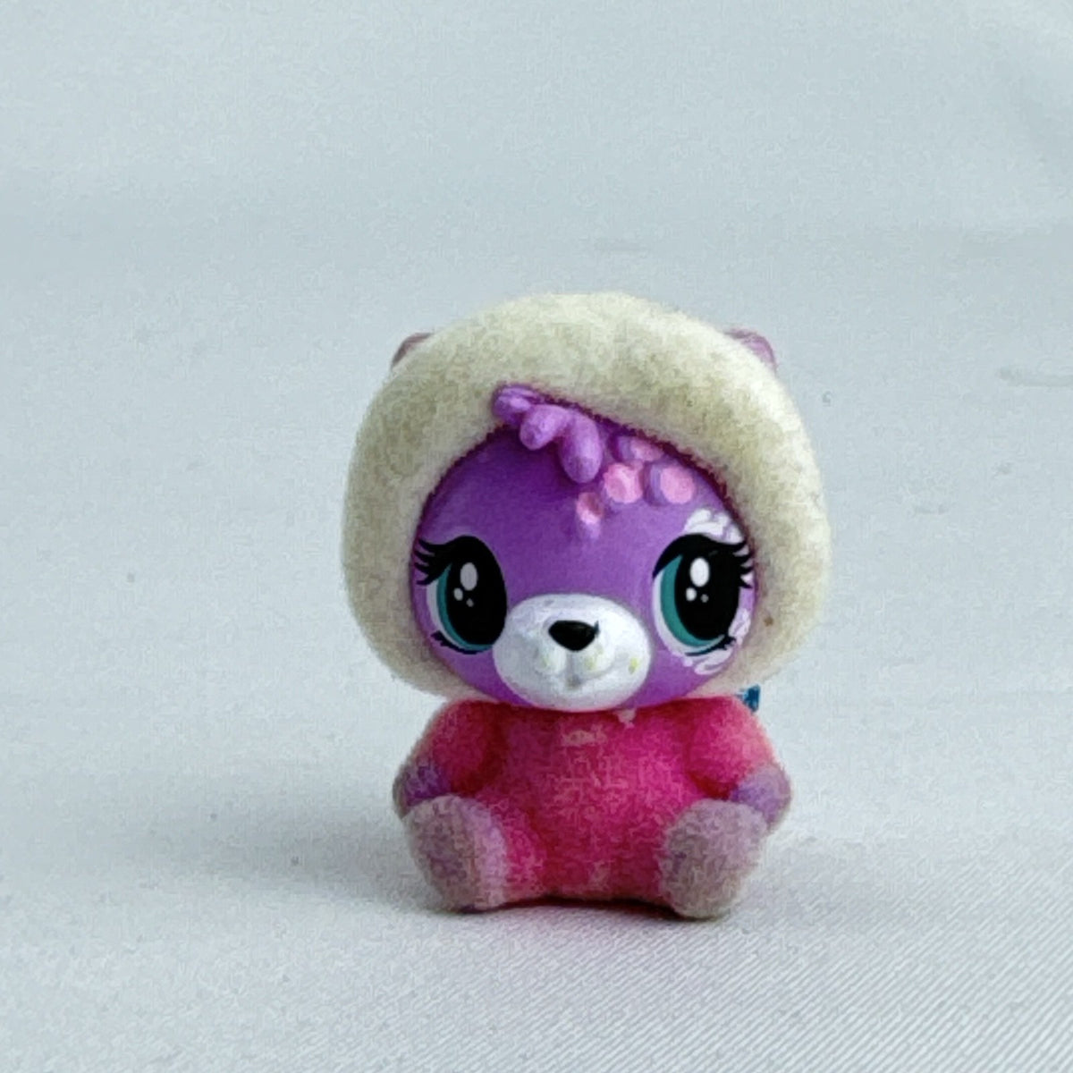 Spin Master Hatchimals CollEGGtibles flocked pink and purple bear mini figure with blue glitter wings