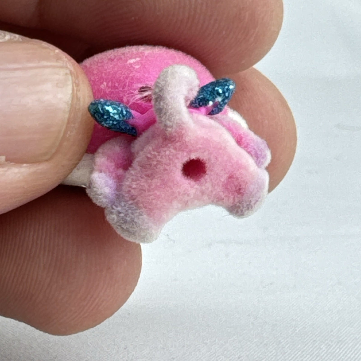 Spin Master Hatchimals CollEGGtibles flocked pink and purple bear mini figure with blue glitter wings
