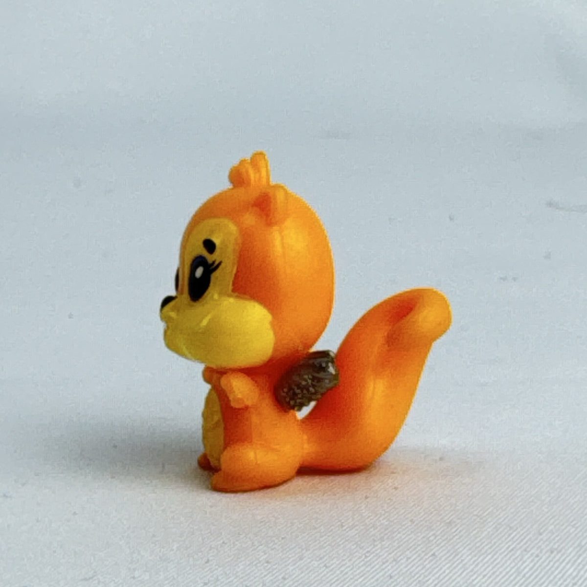 Spin Master Hatchimals CollEGGtibles orange squirrel mini figure with silver glitter wings
