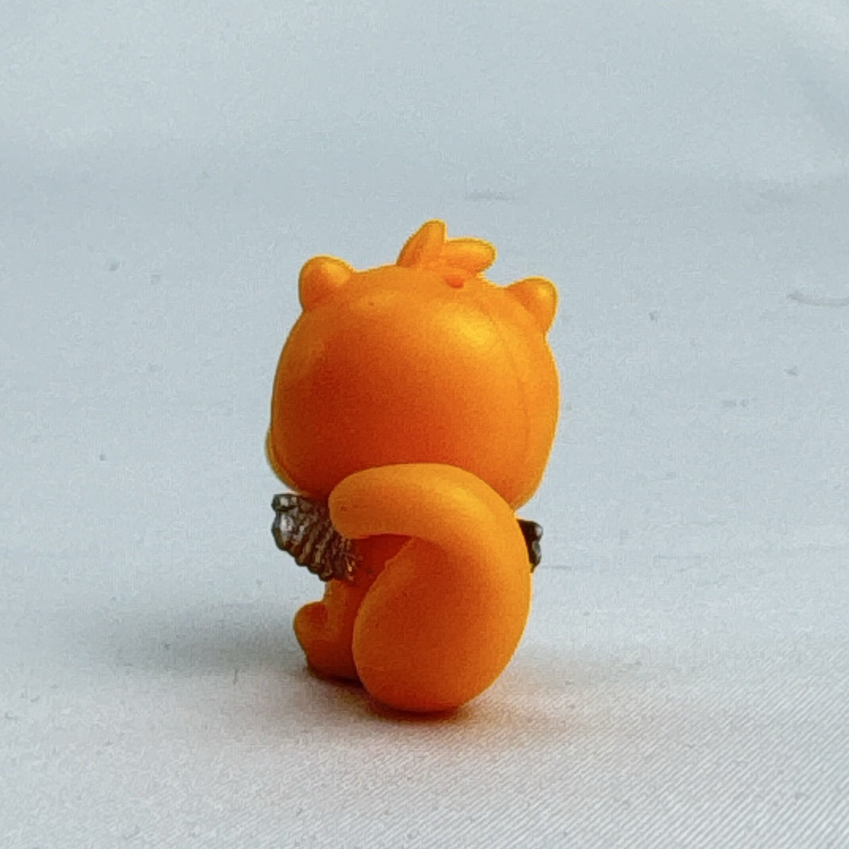 Spin Master Hatchimals CollEGGtibles orange squirrel mini figure with silver glitter wings