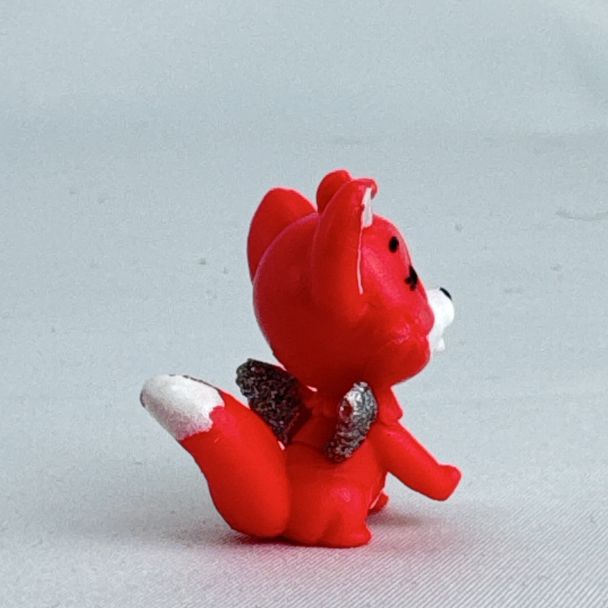 Spin Master Hatchimals Colleggtibles red fox miniature figure with silver glitter wings and winking face