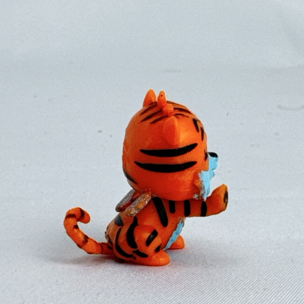 Spin Master Hatchimals Colleggtibles orange tiger miniature figure with silver glitter wings
