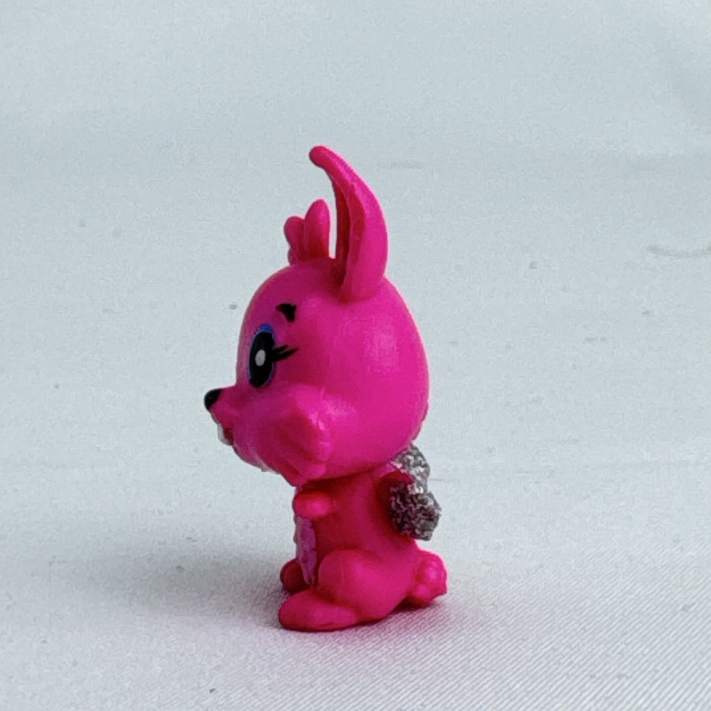 Spin Master Hatchimals CollEGGtibles pink winking bunny figure with silver glitter wings