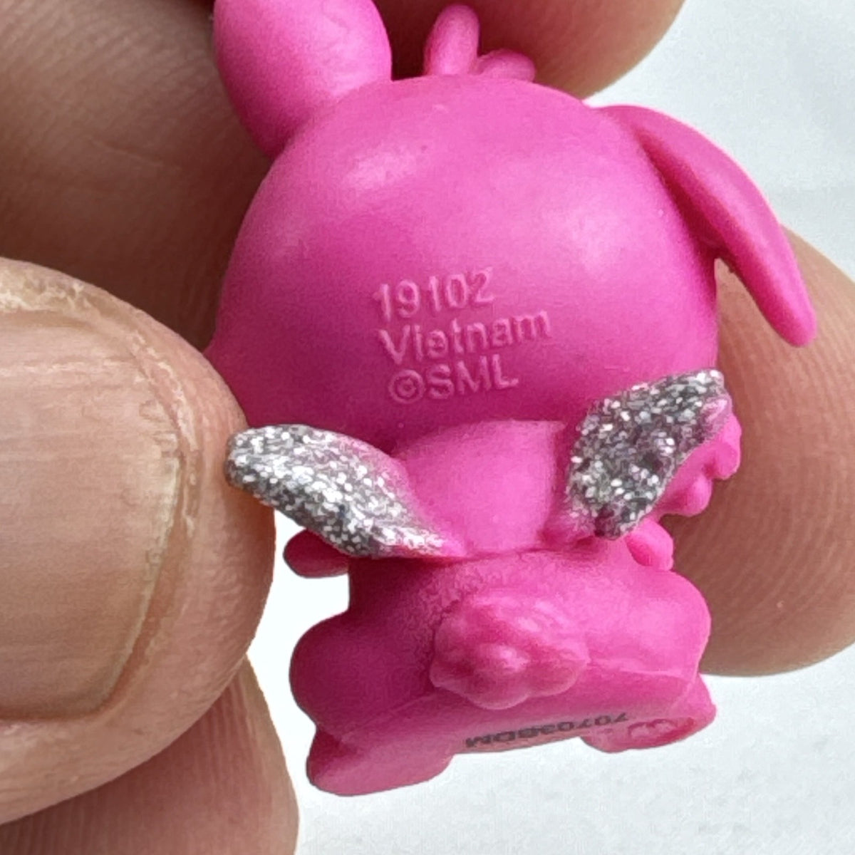 Spin Master Hatchimals CollEGGtibles pink winking bunny figure with silver glitter wings