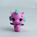 Spin Master Hatchimals Colleggtibles miniature pink seahorse figure with mint green accents and purple glitter wings.