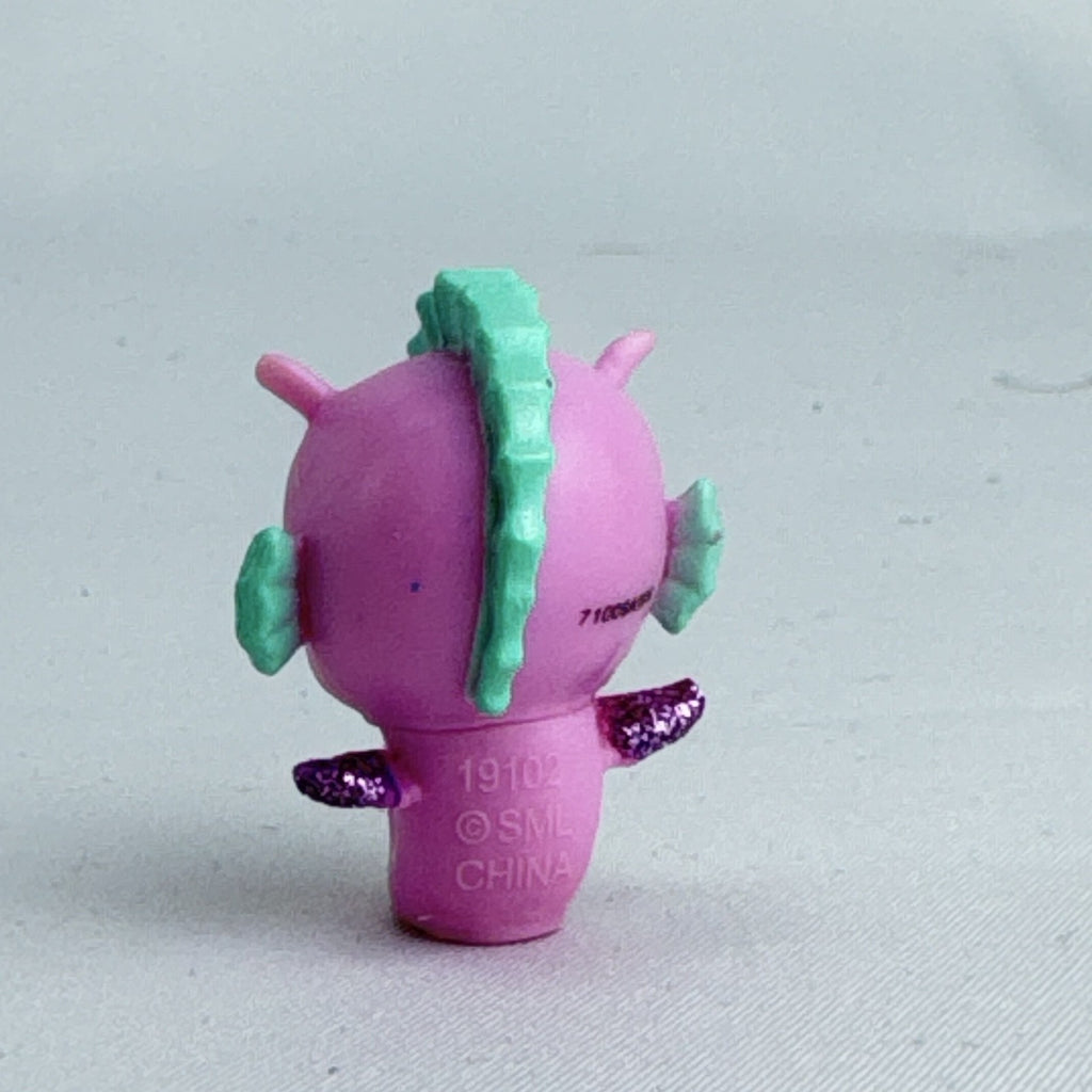 Spin Master Hatchimals Colleggtibles miniature pink seahorse figure with mint green accents and purple glitter wings.